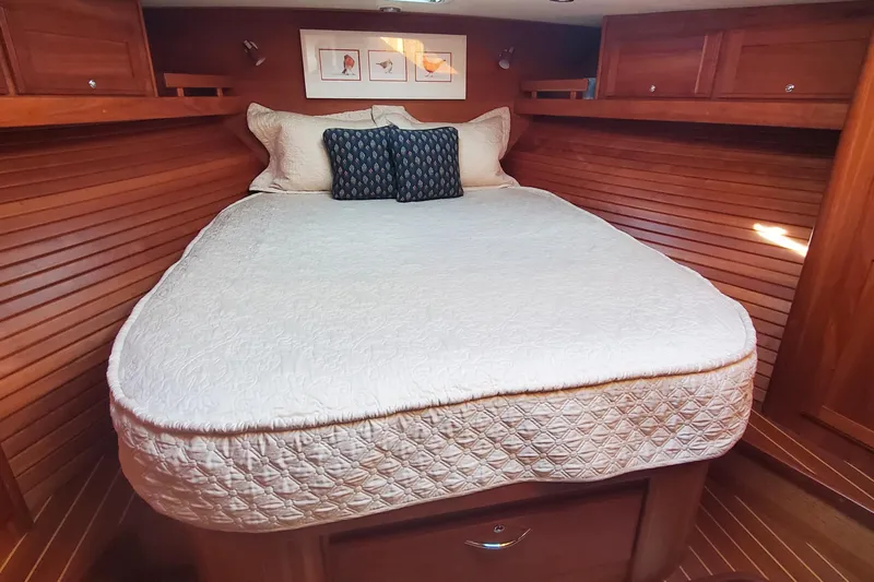 Brio Yacht Photos Pics Luxurious cabin interior of 2012 Sabre 48 Salon Express with cozy bed and wooden finish.