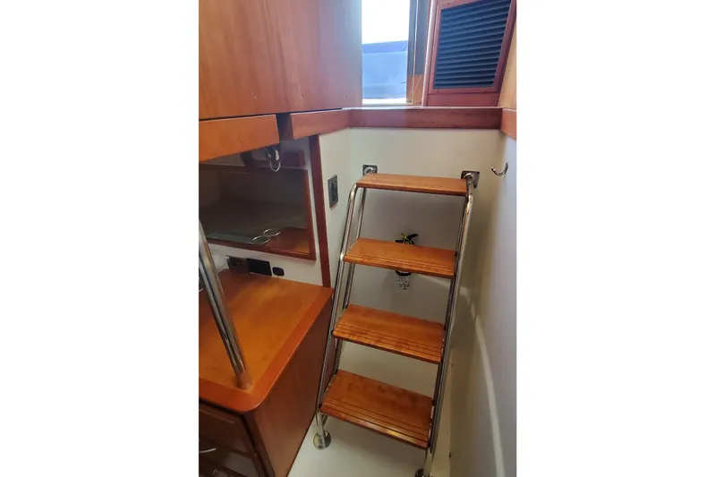 Brio Yacht Photos Pics Interior of 2012 Sabre 48 Salon Express with wooden steps and cabinetry.