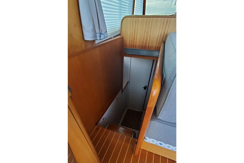 Brio Yacht Photos Pics 2012 Sabre 48 Salon Express interior with wooden stairs and cozy cabin.