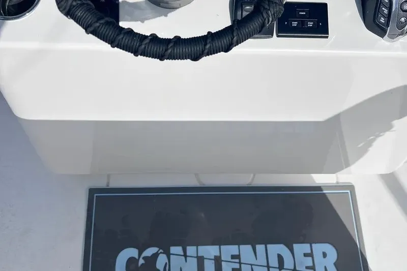  Yacht Photos Pics 2024 Contender 30 Tournament boat dashboard with steering wheel and controls.