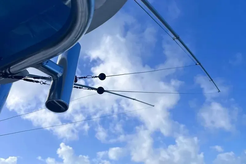  Yacht Photos Pics Outriggers on a 2024 Contender 30 Tournament boat against a blue sky.