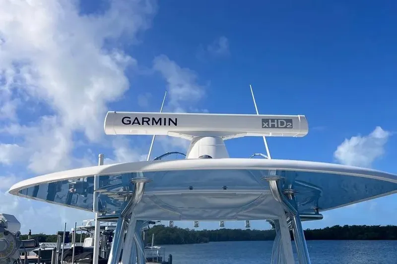  Yacht Photos Pics 2024 Contender 30 Tournament boat with Garmin xHD2 radar against blue sky.