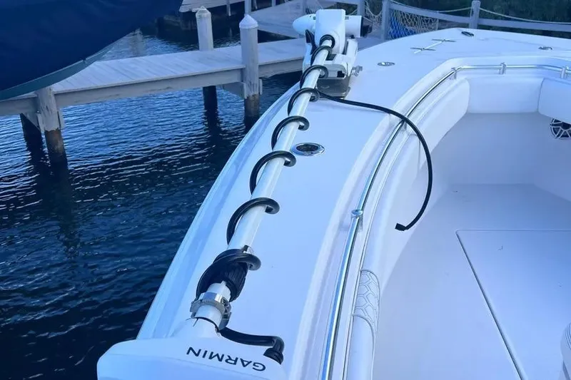  Yacht Photos Pics 2024 Contender 30 Tournament boat with Garmin equipment docked by the water.