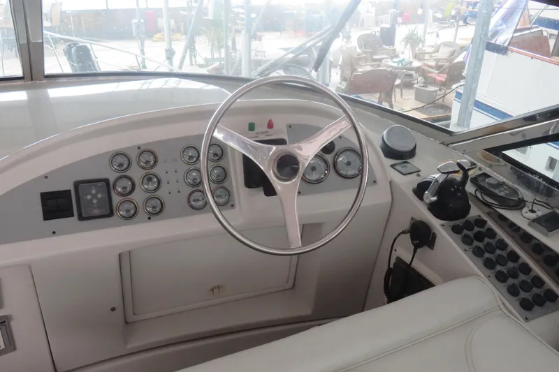 Just Us Yacht Photos Pics Cockpit of 2000 Bluewater Yachts 5800 with steering wheel and control panel.