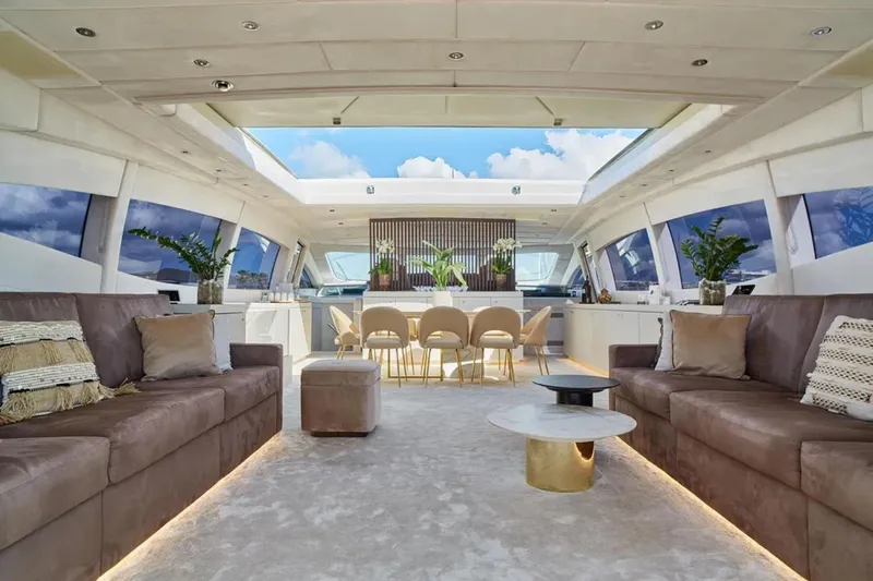  Yacht Photos Pics Luxurious interior of 2003 Mangusta 108 yacht with elegant seating and dining area.