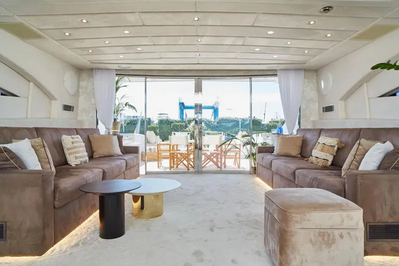  Yacht Photos Pics Luxurious interior of 2003 Mangusta 108 yacht with plush seating and elegant decor.