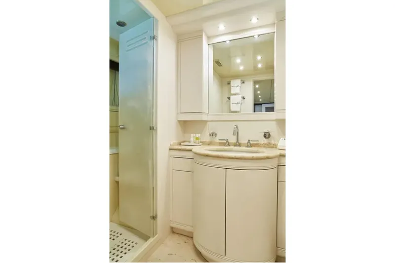  Yacht Photos Pics Luxurious bathroom in 2003 Mangusta 108 yacht with elegant fixtures and modern design.