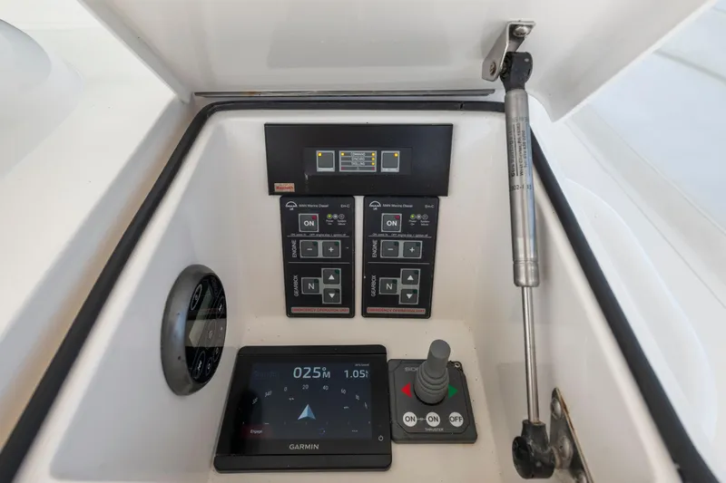  Yacht Photos Pics Control panel of a 2009 Viking 50 Convertible yacht with Garmin navigation display.