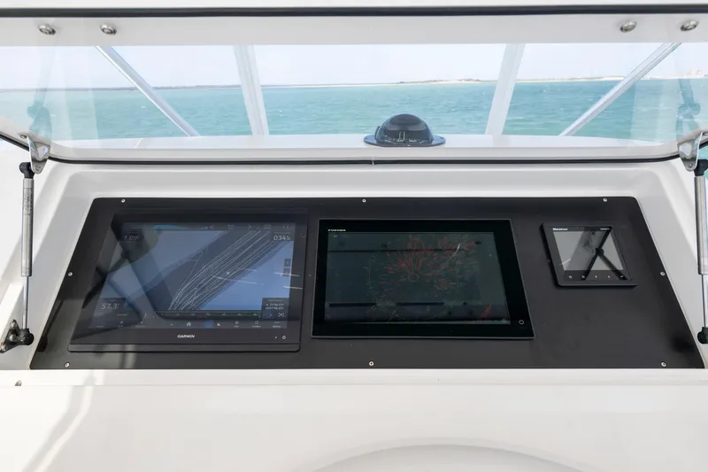  Yacht Photos Pics Control panel of a 2009 Viking 50 Convertible yacht with navigation displays.