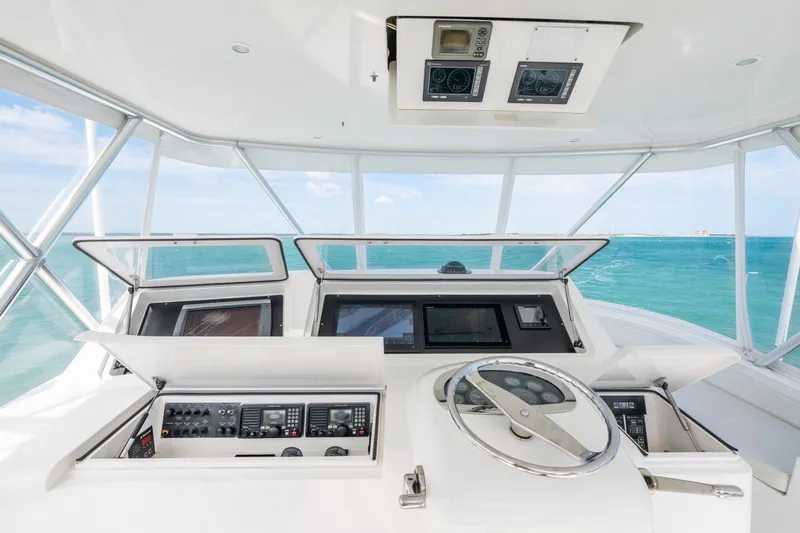  Yacht Photos Pics Helm of 2009 Viking 50 Convertible yacht with ocean view, featuring advanced navigation controls.