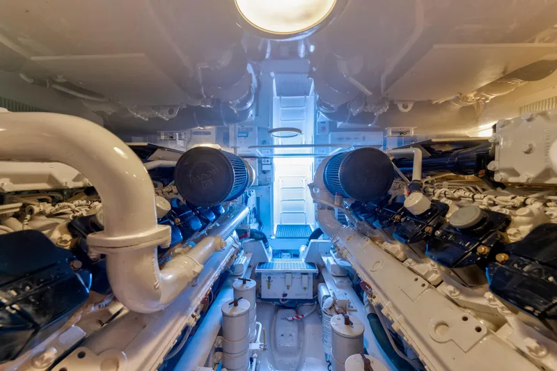  Yacht Photos Pics Engine room of 2009 Viking 50 Convertible yacht, showcasing dual engines and mechanical components.