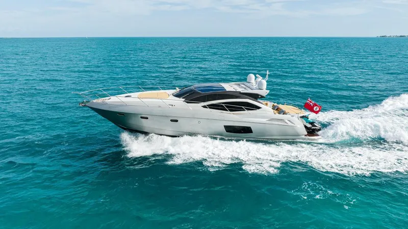 Yacht Photos Pics 2011 Sunseeker 64 Predator yacht cruising on open blue sea.