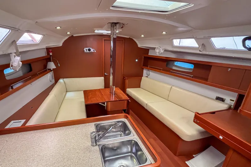 Marley Yacht Photos Pics Interior of 2015 Beneteau Oceanis 37 sailboat with cozy seating and modern design.