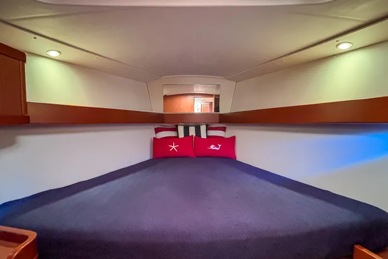 Marley Yacht Photos Pics Cozy cabin interior of 2015 Beneteau Oceanis 37 sailboat with plush bedding.