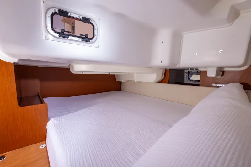 Marley Yacht Photos Pics Cozy cabin interior of 2015 Beneteau Oceanis 37 sailboat with comfortable bedding.