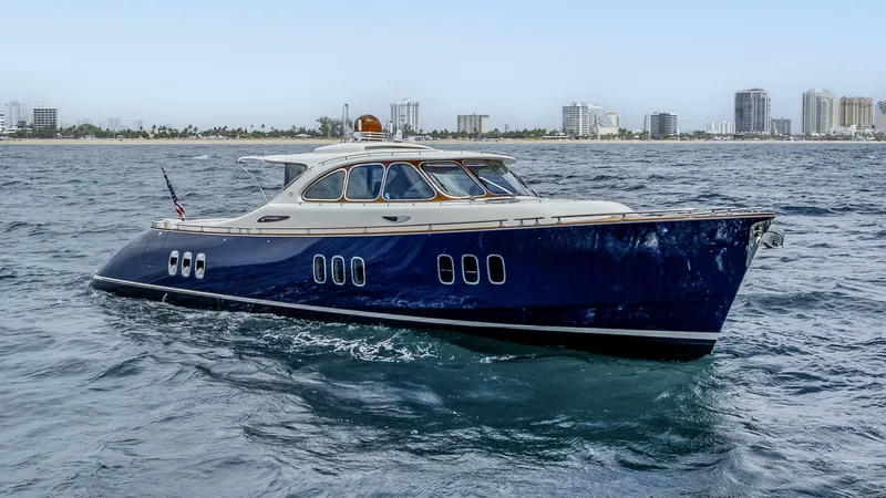 Shaken Not Stirred Yacht Photos Pics 2019 Zeelander Z55 yacht cruising on the ocean with city skyline in background.