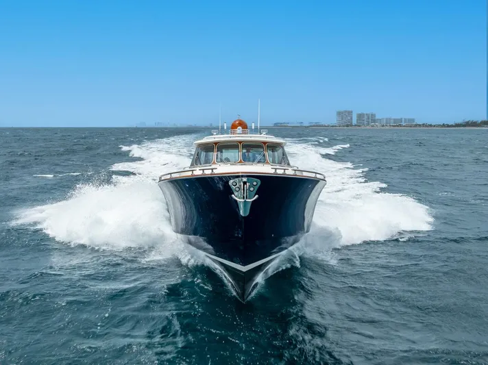 Shaken Not Stirred Yacht Photos Pics 2019 Zeelander Z55 yacht cruising on open water, city skyline in background.