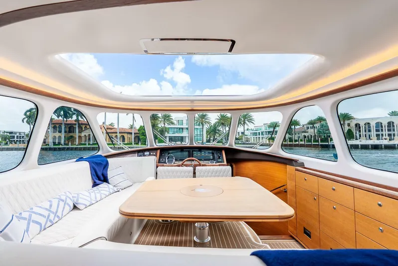 Shaken Not Stirred Yacht Photos Pics Luxurious interior of 2019 Zeelander Z55 yacht with panoramic windows and elegant seating.