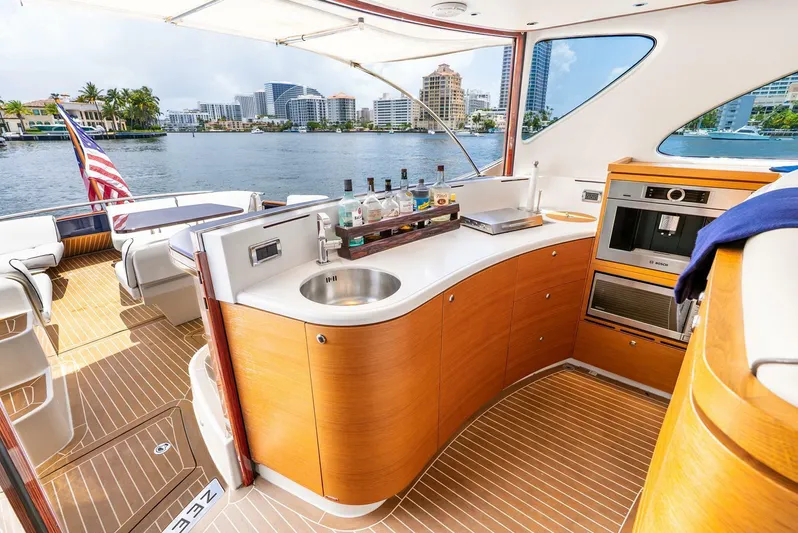 Shaken Not Stirred Yacht Photos Pics Luxurious 2019 Zeelander Z55 yacht interior with modern kitchen and scenic waterfront view.