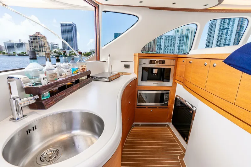 Shaken Not Stirred Yacht Photos Pics Luxurious 2019 Zeelander Z55 yacht kitchen with modern appliances and waterfront view.