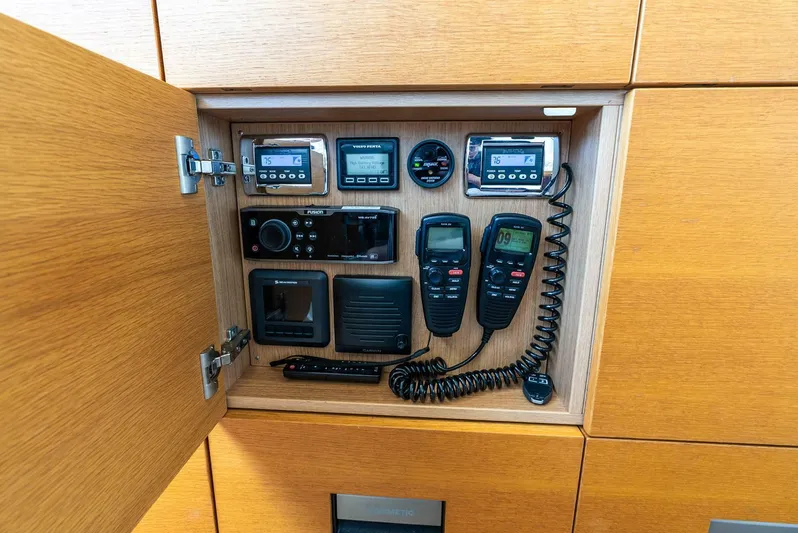 Shaken Not Stirred Yacht Photos Pics Control panel inside a 2019 Zeelander Z55 yacht, featuring communication and navigation equipment.