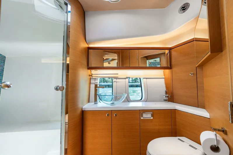 Shaken Not Stirred Yacht Photos Pics Luxurious bathroom interior of 2019 Zeelander Z55 yacht with modern fixtures and wooden cabinetry.