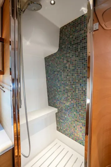 Shaken Not Stirred Yacht Photos Pics Luxurious shower in 2019 Zeelander Z55 yacht with mosaic tile accent wall.