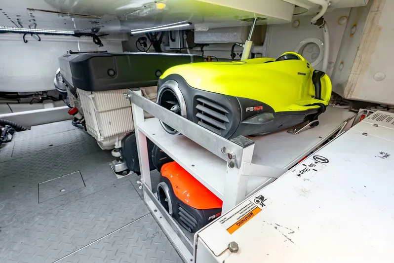Shaken Not Stirred Yacht Photos Pics Engine room of 2019 Zeelander Z55 yacht with stored water scooters.