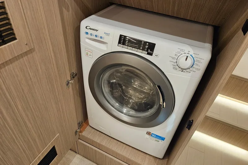  Yacht Photos Pics Front-loading washing machine in wooden cabinet, Prestige F4.9, 2026 model.