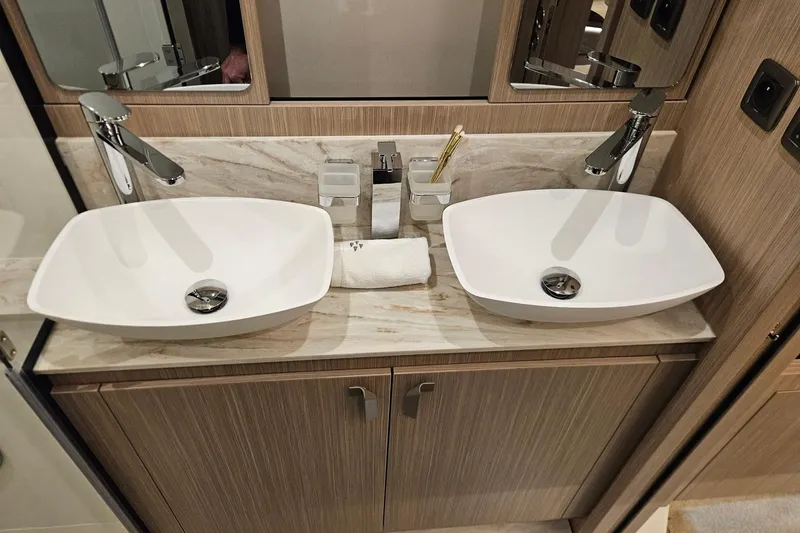  Yacht Photos Pics Modern double sink vanity in Prestige F4.9, 2026 model, with sleek faucets and marble countertop.