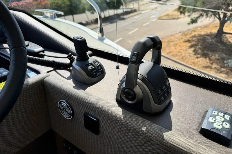  Yacht Photos Pics Control panel of a 2026 Prestige F4.9 boat, featuring advanced navigation controls.