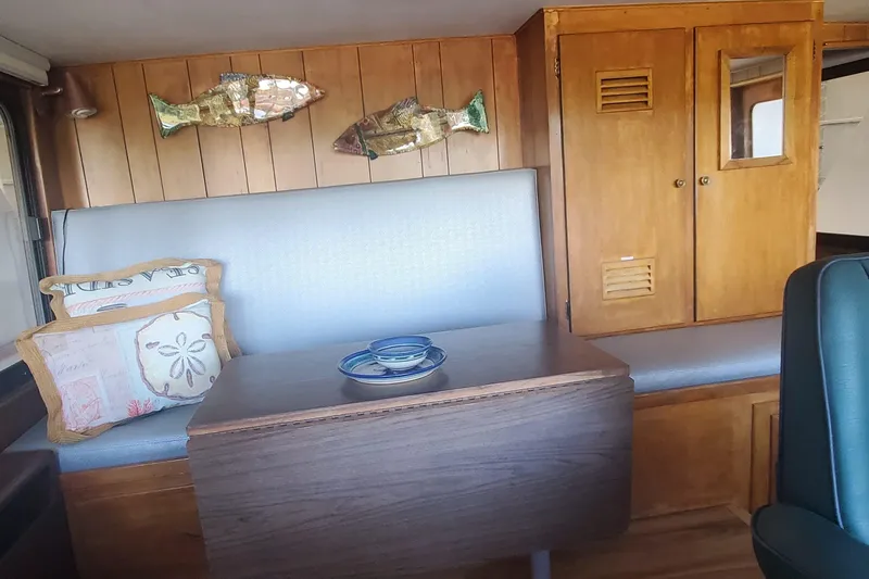 Regal Countess Yacht Photos Pics Interior of 1965 Tacoma Boat Works Bill Garden Motor Yacht with wooden paneling and decor.