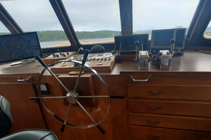 Regal Countess Yacht Photos Pics 1965 Tacoma Boat Works Bill Garden Motor Yacht helm with navigation equipment and wooden dashboard.