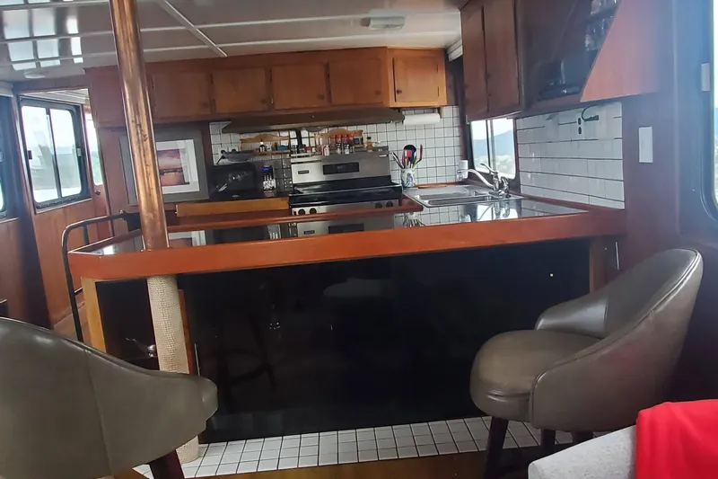 Regal Countess Yacht Photos Pics Interior of 1965 Tacoma Boat Works Bill Garden Motor Yacht with modern kitchen amenities.