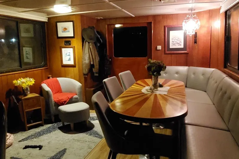 Regal Countess Yacht Photos Pics Luxurious 1965 Tacoma Boat Works Bill Garden Motor Yacht interior with elegant dining area.