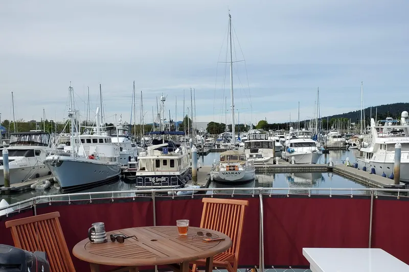 Regal Countess Yacht Photos Pics Marina view with Tacoma Boat Works 1965 Bill Garden Motor Yacht, surrounded by other boats.