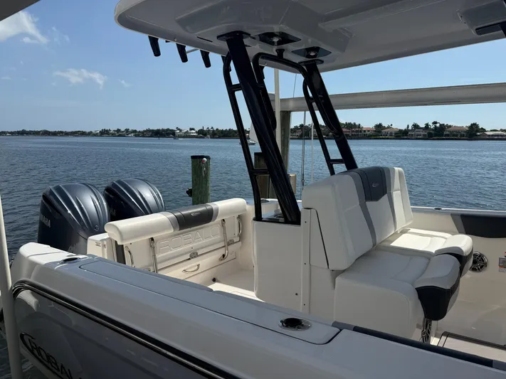 272-203 Brokerage Sebastian Yacht Photos Pics 2023 Robalo R272 Center Console boat with dual engines on a sunny day.