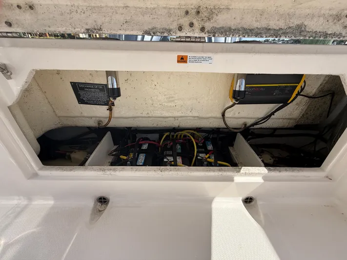 272-203 Brokerage Sebastian Yacht Photos Pics 2023 Robalo R272 Center Console battery compartment with wiring and components.
