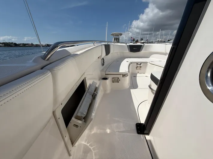 272-203 Brokerage Sebastian Yacht Photos Pics 2023 Robalo R272 Center Console boat interior with sleek seating and storage.