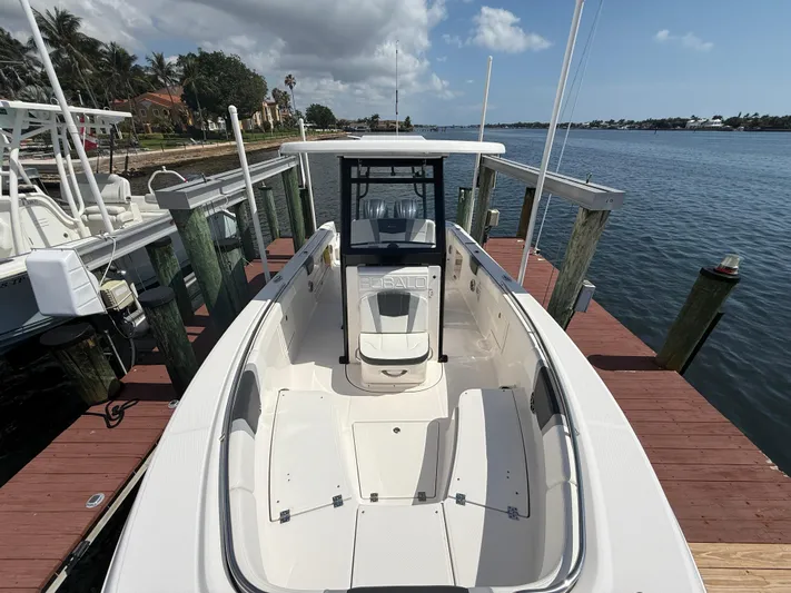 272-203 Brokerage Sebastian Yacht Photos Pics 2023 Robalo R272 Center Console boat docked by the water.