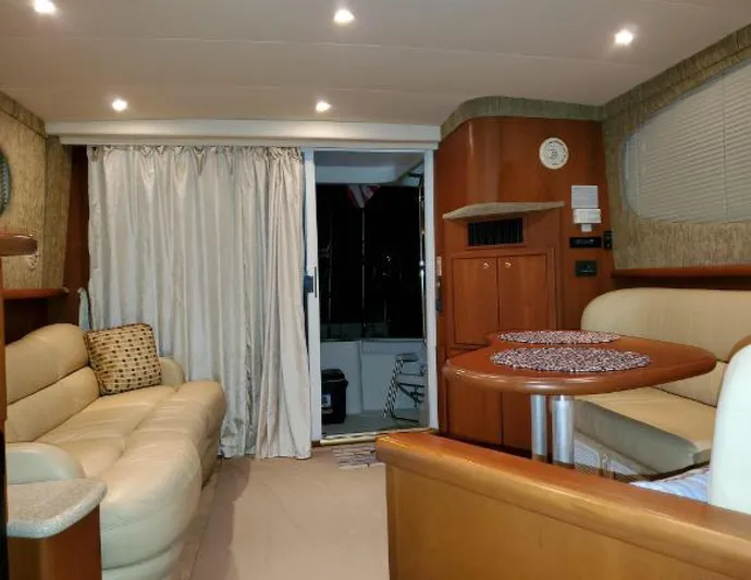  Yacht Photos Pics Interior of 2005 Silverton 34 Convertible yacht with cozy seating and dining area.