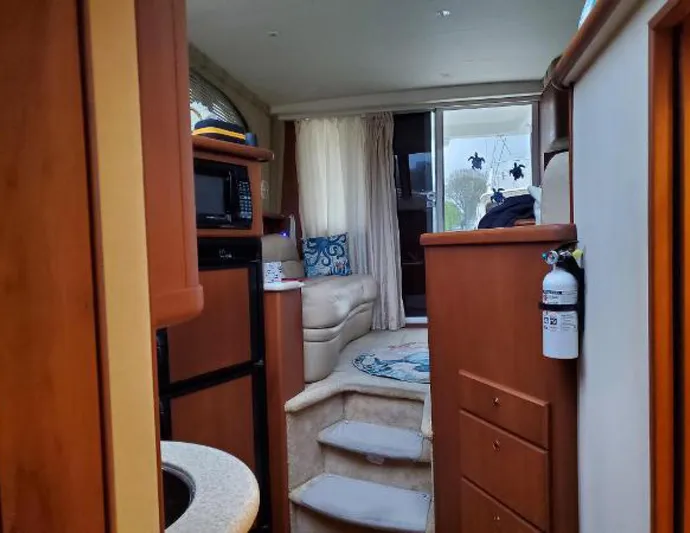  Yacht Photos Pics Interior of 2005 Silverton 34 Convertible yacht, featuring cozy seating and modern amenities.