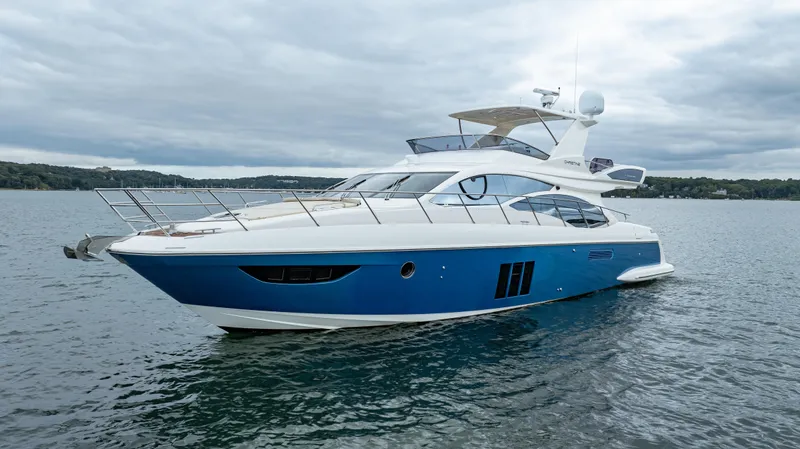 Christine Yacht Photos Pics 2011 Azimut 58 Flybridge yacht on calm water, showcasing sleek design and luxury features.
