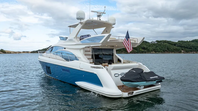 Christine Yacht Photos Pics Azimut 58 Flybridge 2011 yacht on water, featuring sleek design and American flag.