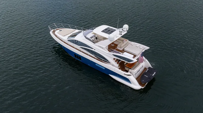 Christine Yacht Photos Pics 2011 Azimut 58 Flybridge yacht cruising on open water.