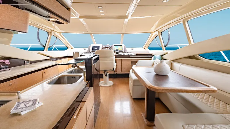 Christine Yacht Photos Pics Luxurious interior of 2011 Azimut 58 Flybridge yacht with modern kitchen and seating area.