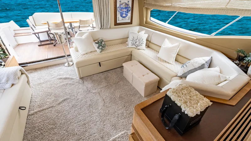 Christine Yacht Photos Pics Luxurious interior of 2011 Azimut 58 Flybridge yacht with elegant seating and ocean view.