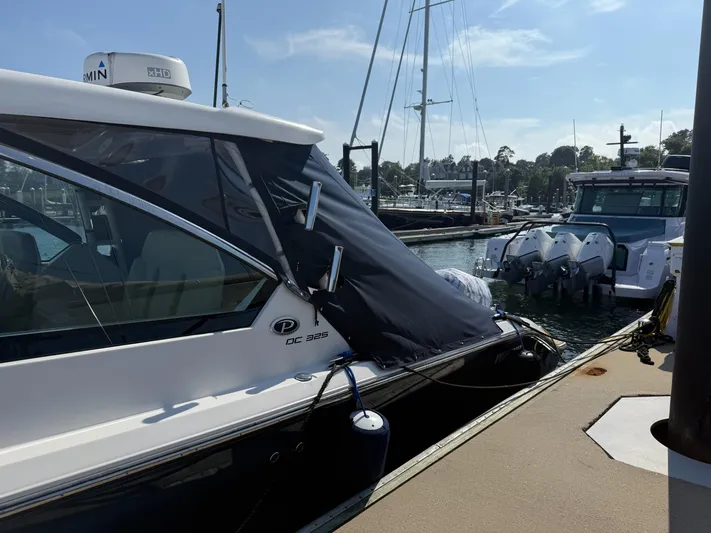 Adios Yacht Photos Pics 2018 Pursuit DC 325 Dual Console boat docked at marina, sunny day.