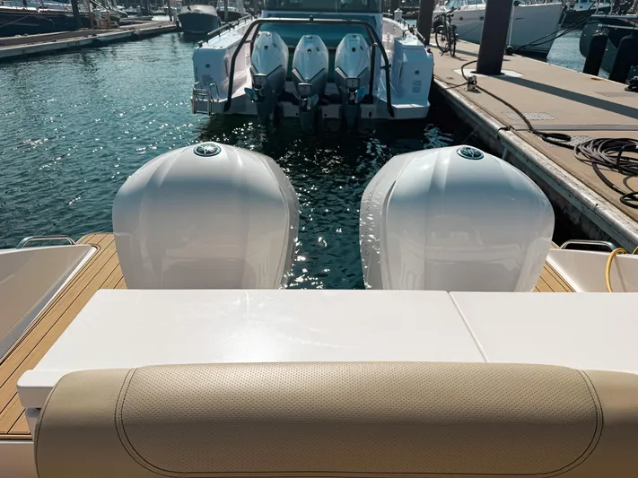 Adios Yacht Photos Pics 2018 Pursuit DC 325 Dual Console boat with twin engines docked at marina.