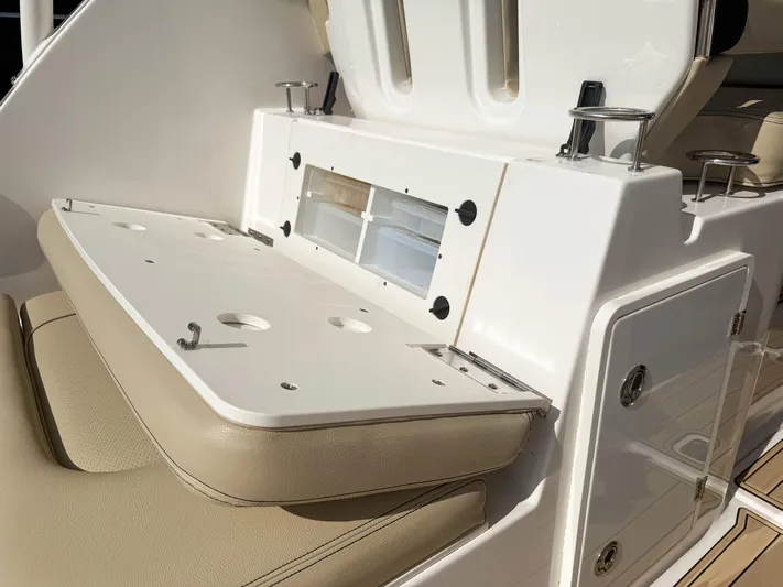 Adios Yacht Photos Pics 2018 Pursuit DC 325 Dual Console boat interior with seating and storage compartments.